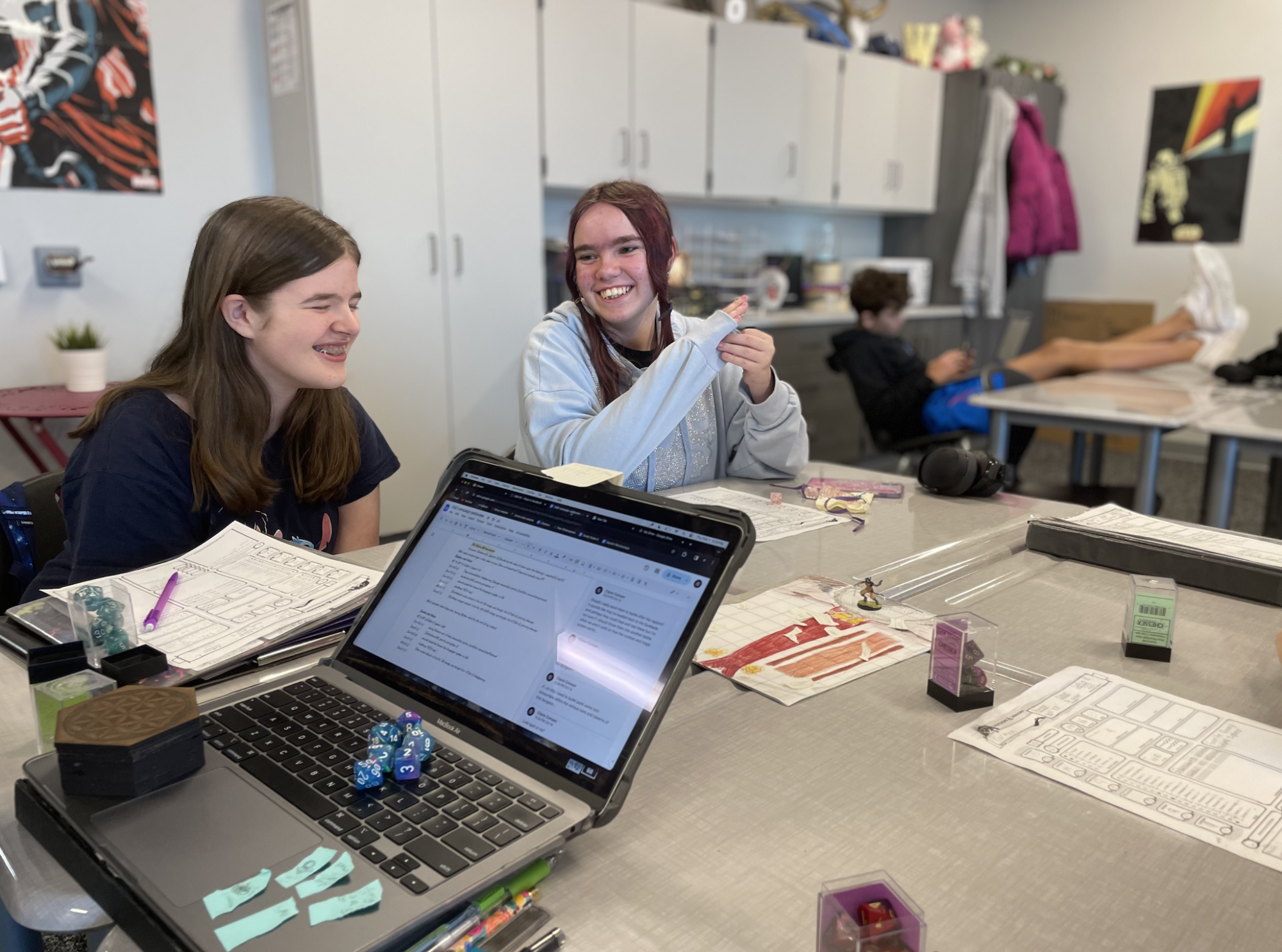 Playing through their campaign on Feb. 1, Katelyn Clayton (9) and Abigail Sullivan (9) laugh with the rest of their campaign group.